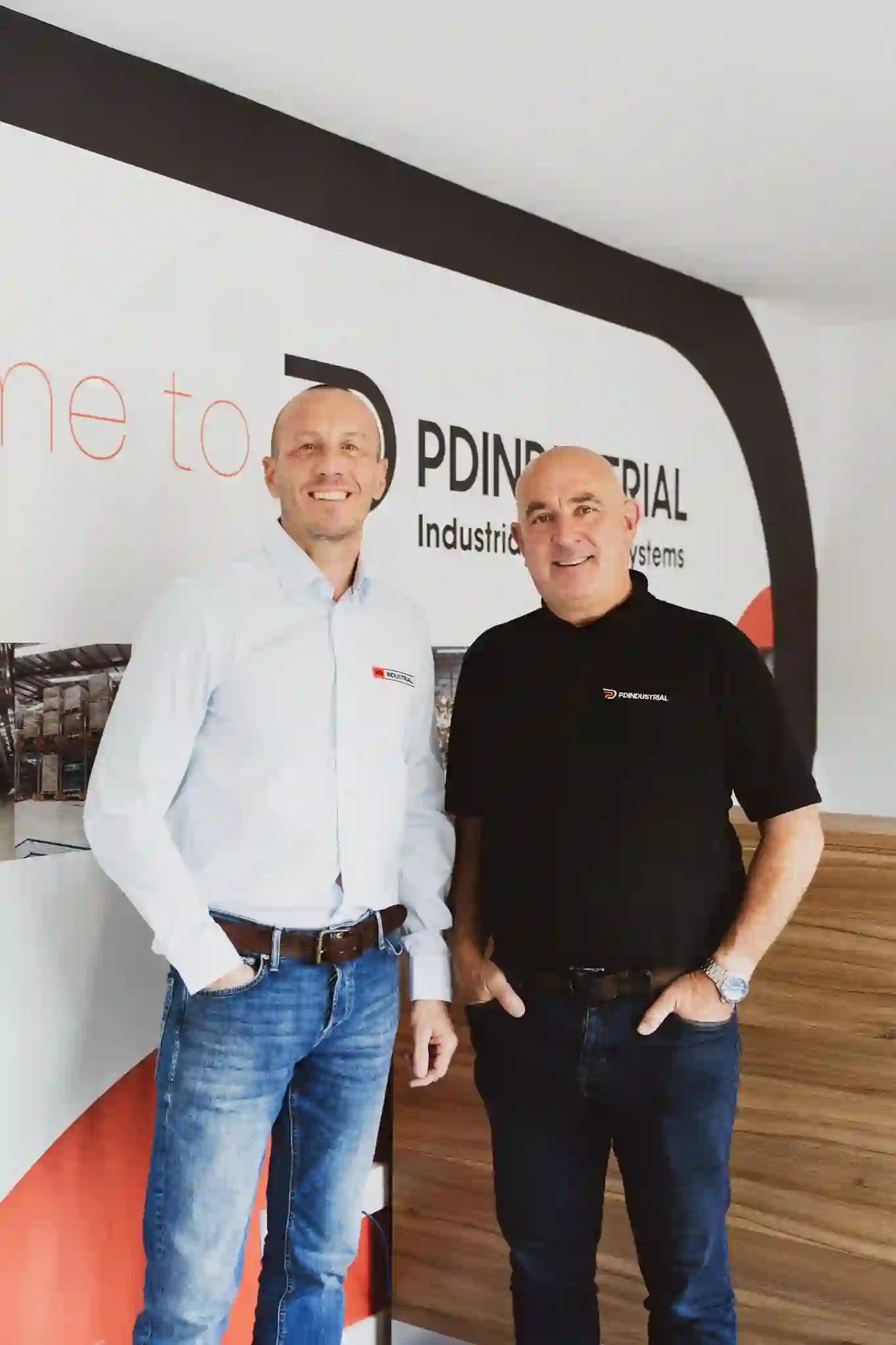 Two PD Industrial team members stood together for a group portrait