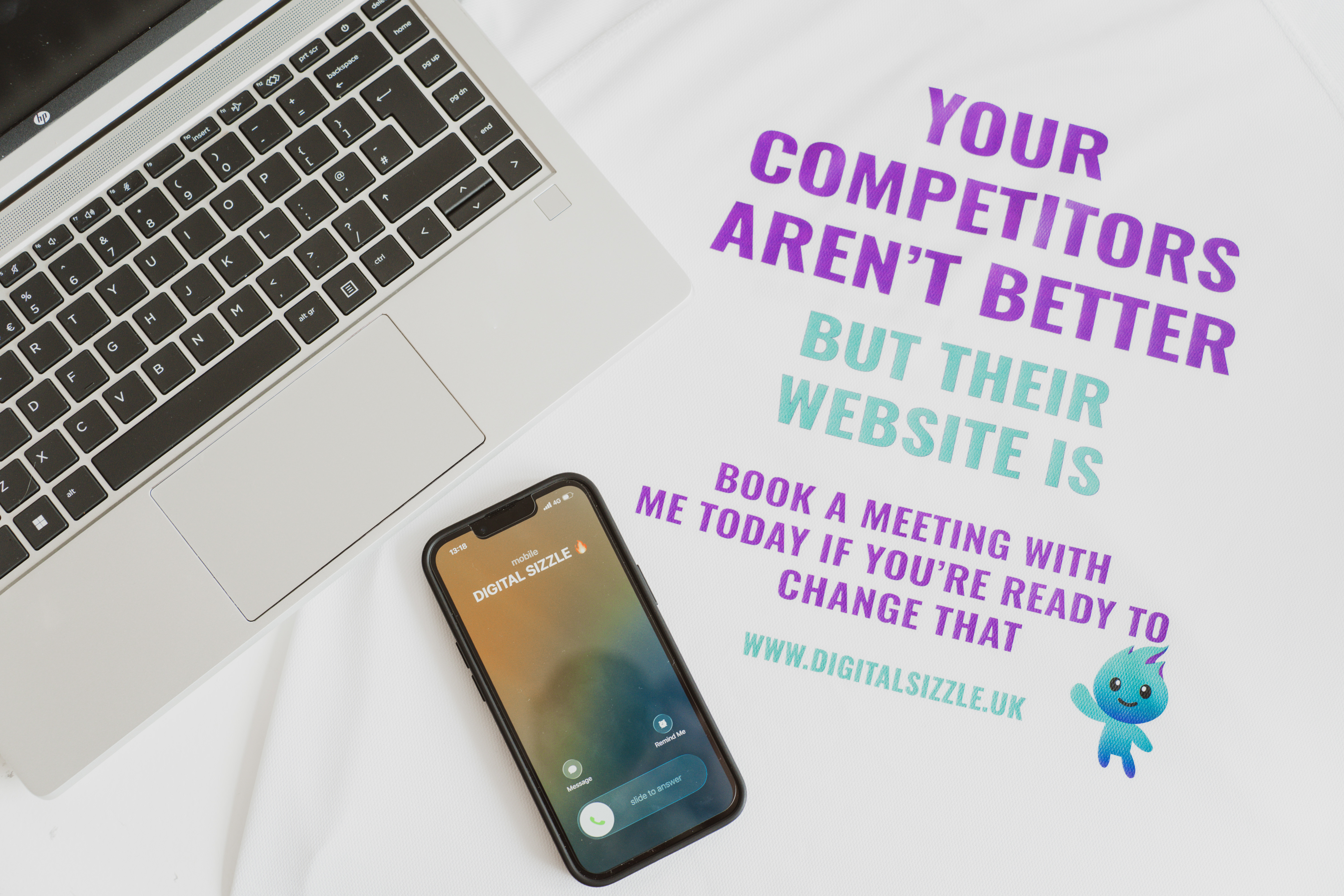 Digital Sizzle branded laptop, t-shirt and mobile phone