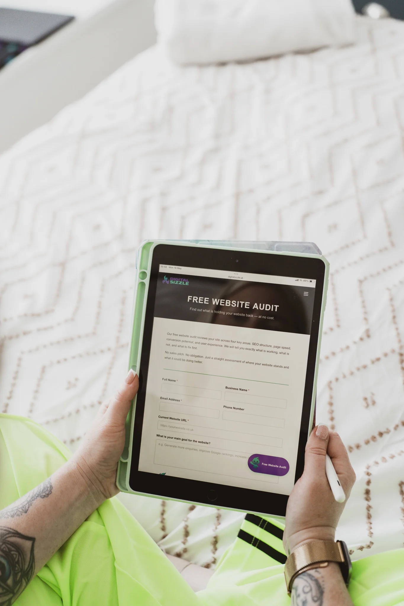 Tablet displaying the Digital Sizzle UK free website audit form